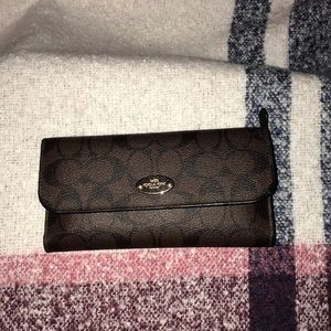 Coach wallet in FAIR condition. A few scuffs noted